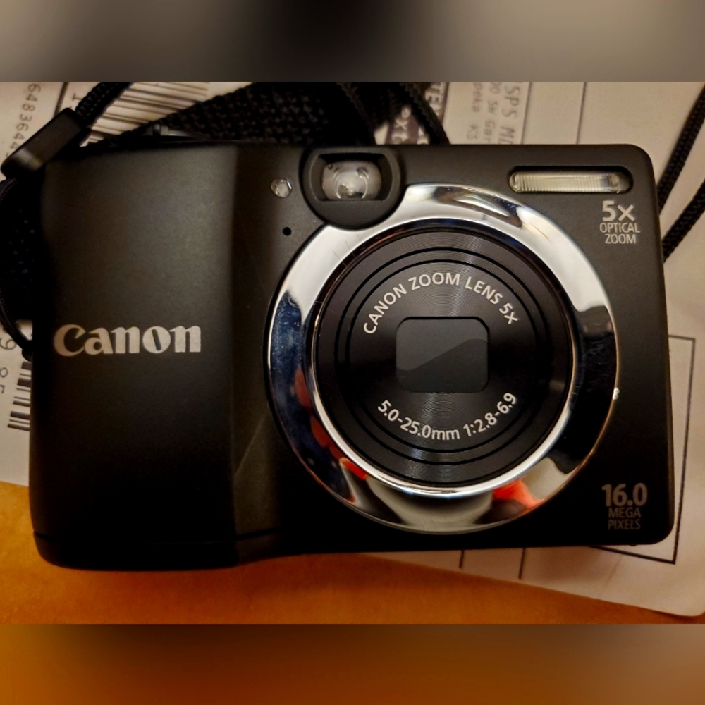 Camera , 5x optical zoom.  Powershot A1400